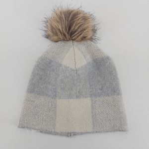 Christian Siriano gray and white check knit hat with faux fur pom pom